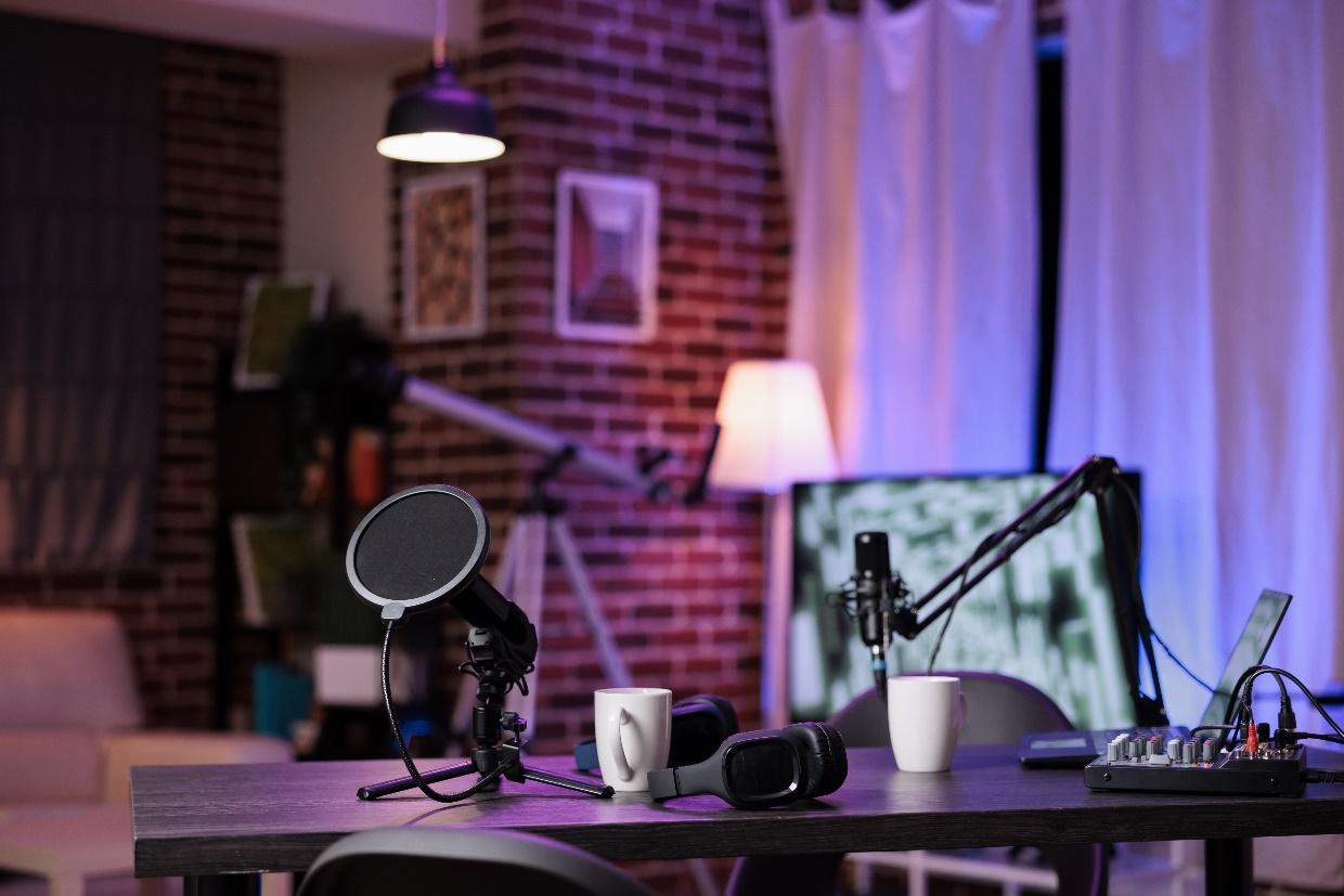 An empty desk with podcast equipment